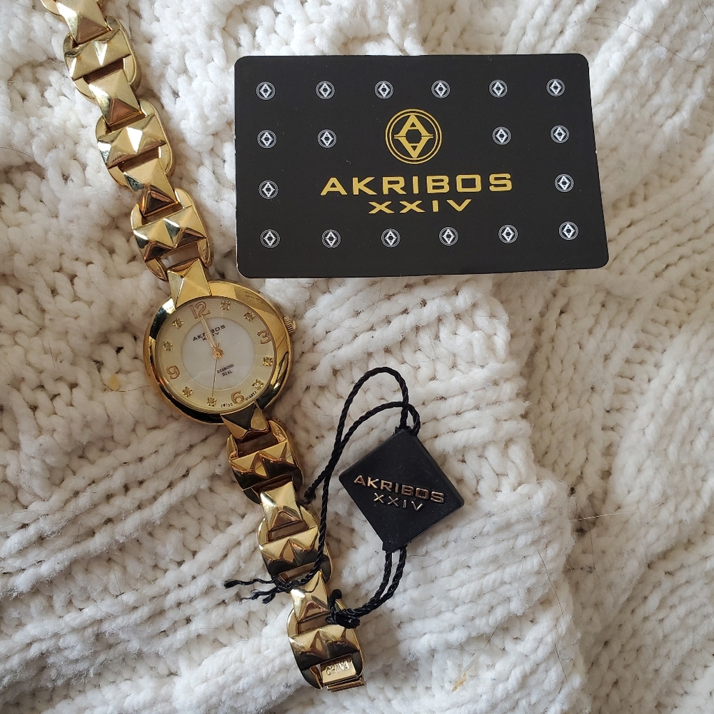Akribos XXIV gold woman's watch
